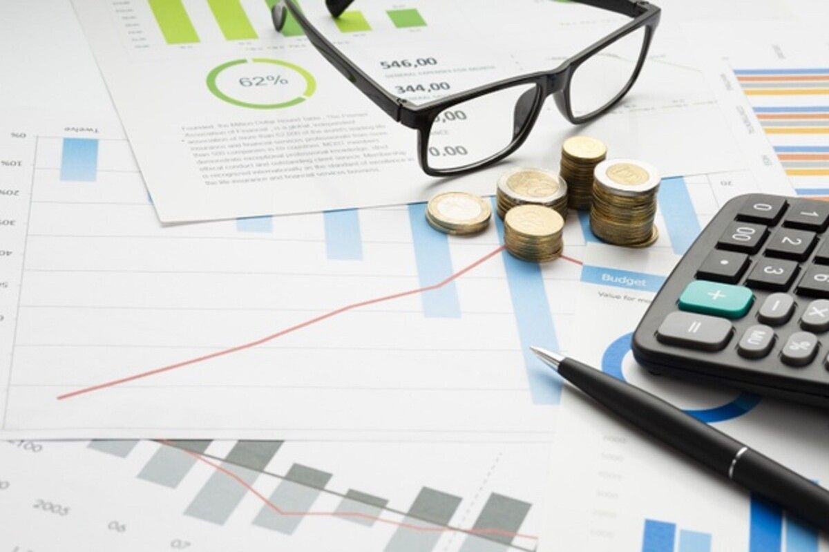close up financial instruments with glasses 23 2148285273