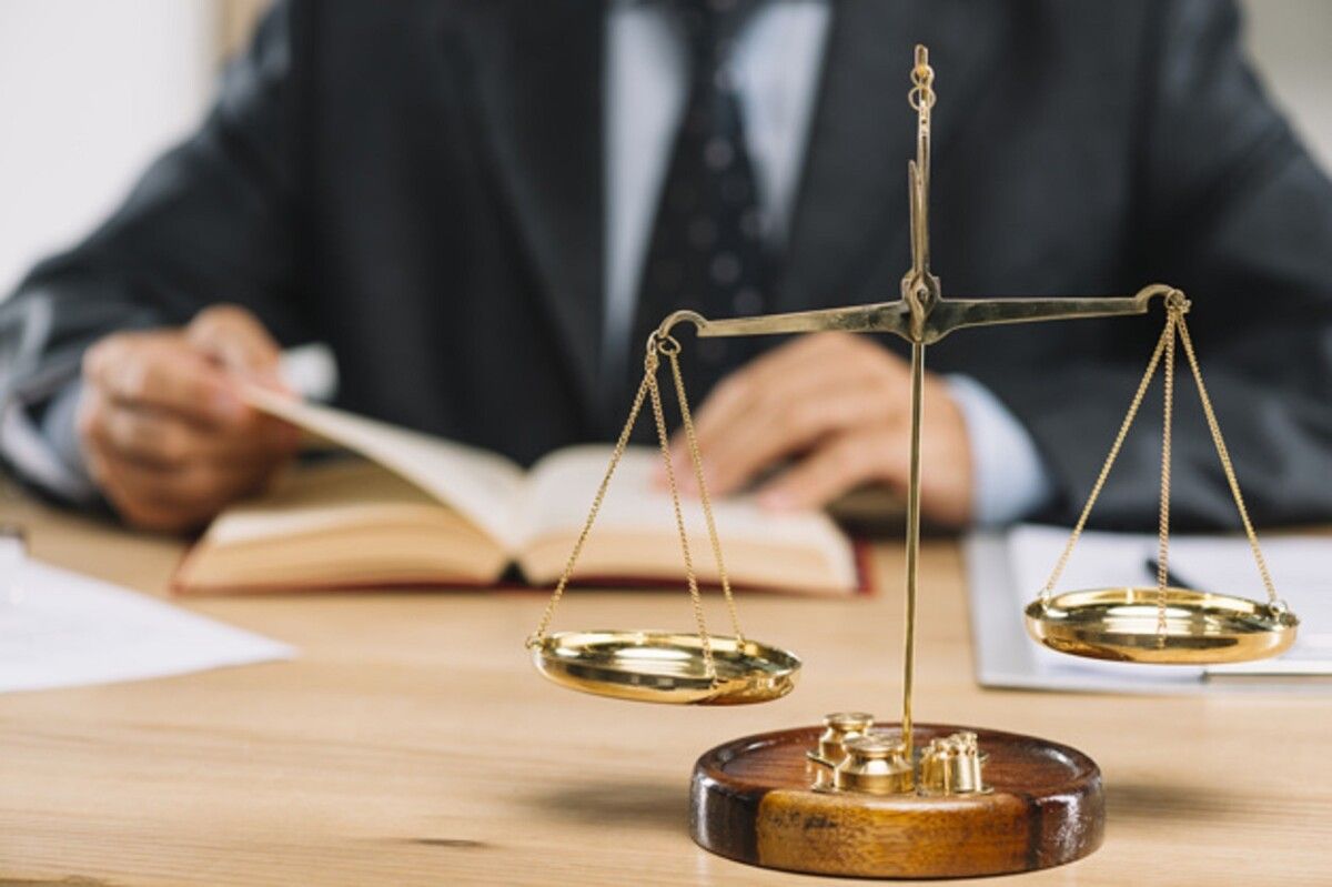 golden justice scale front lawyer reading book table 23 2147898544